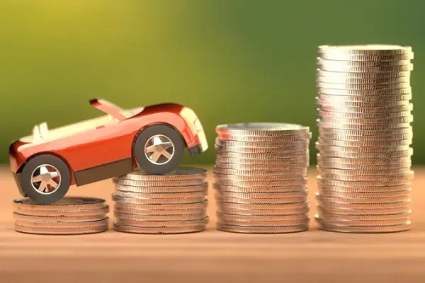 a toy car on a stack of rising coins