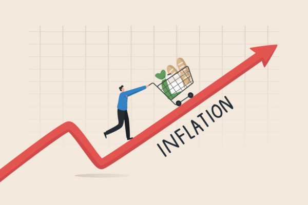 a man pushing a shopping cart up to a red arrow indicating inflation growth