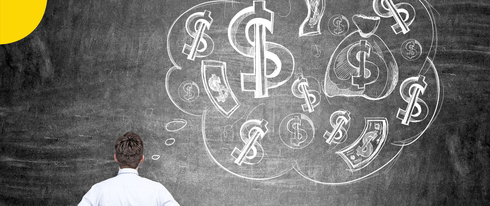 a man looking at a chalkboard with dollar signs thoughts indicating money psychology