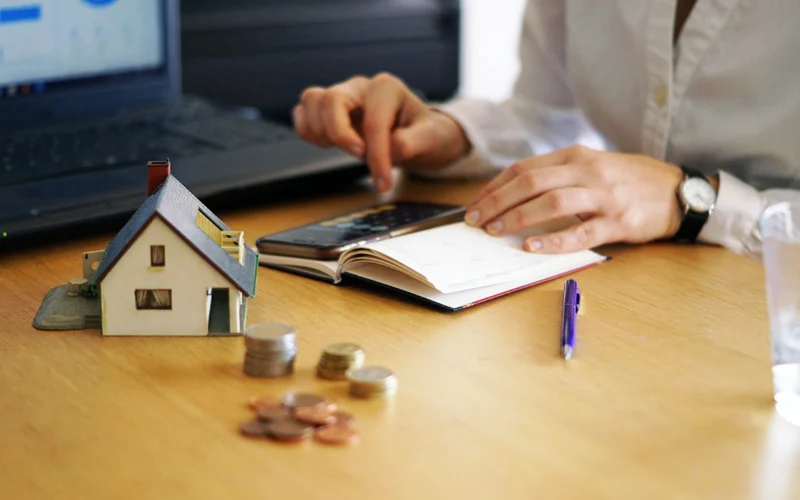 a person calculating a house